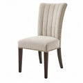 Beige eetkamerstoel met polyester bekleding, donkerbruine rubberhouten poten en goudkleurige siernagels, 48 x 62 x 102 cm
